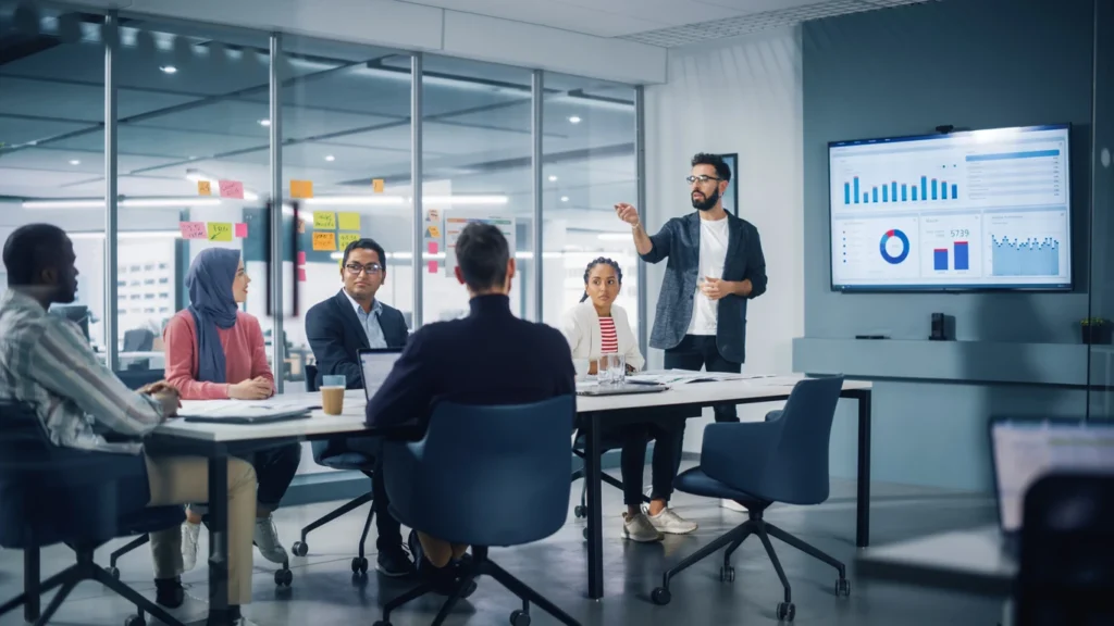 group of lawyers in a board room reviewing website analytics.