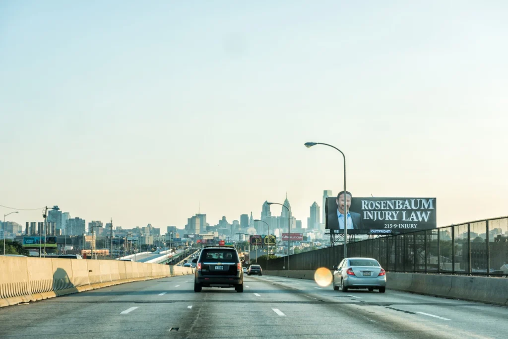 law firm billboard on the side of highway.