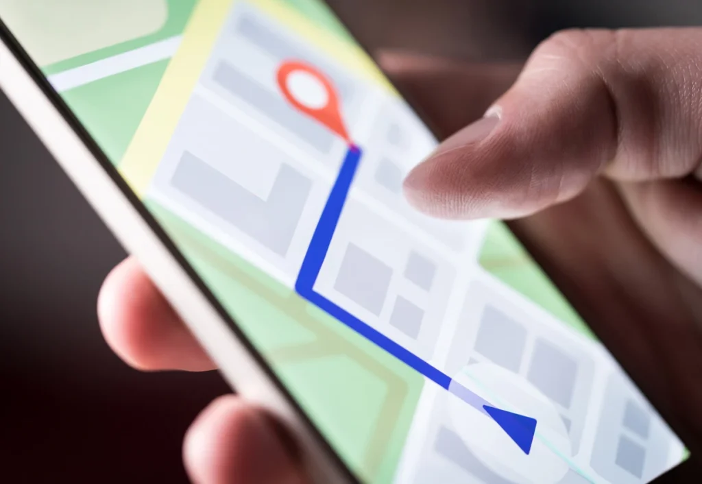 close up of a person using maps to find a business