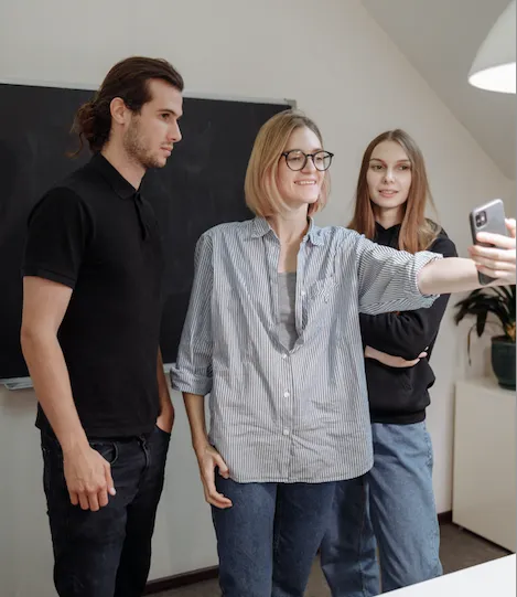 Three people taking a selfie.